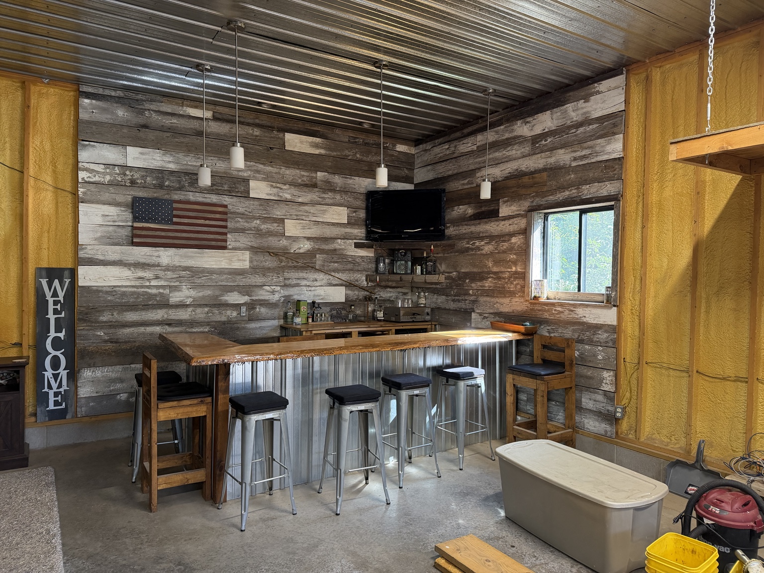 Rustic barn bar with television and counter seating