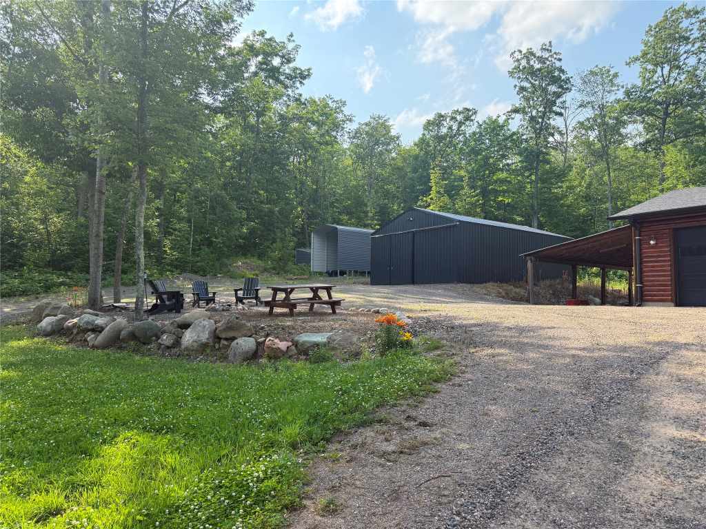 Garage, pole building and parking area