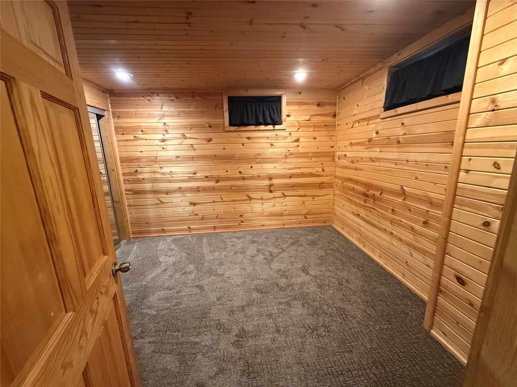 Wood-paneled guest bedroom