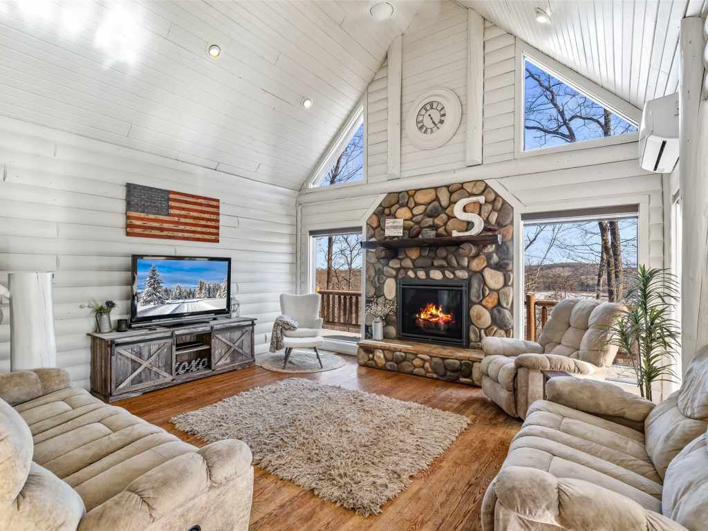 Vaulted great room with river-stone fireplace